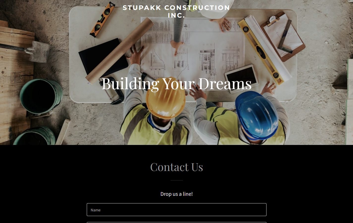 Stupakk Construction's previous homepage: a stock photo of hard hats on a blueprint with 'Building Your Dreams' and a contact form.